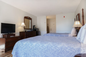 Double Queen Guest Room view of entire room with TV and two queen beds