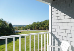 Double Queen Guest Room patio and view of the sweeping lawn and the Sheepscot River